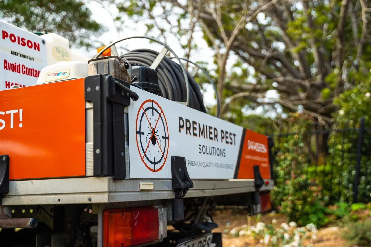 Premier Pest Control technician treating for ants