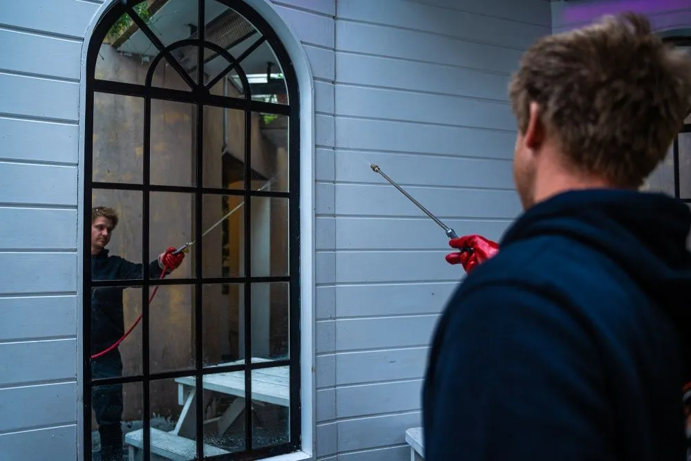 Premier Pest Control technician baiting for rodents