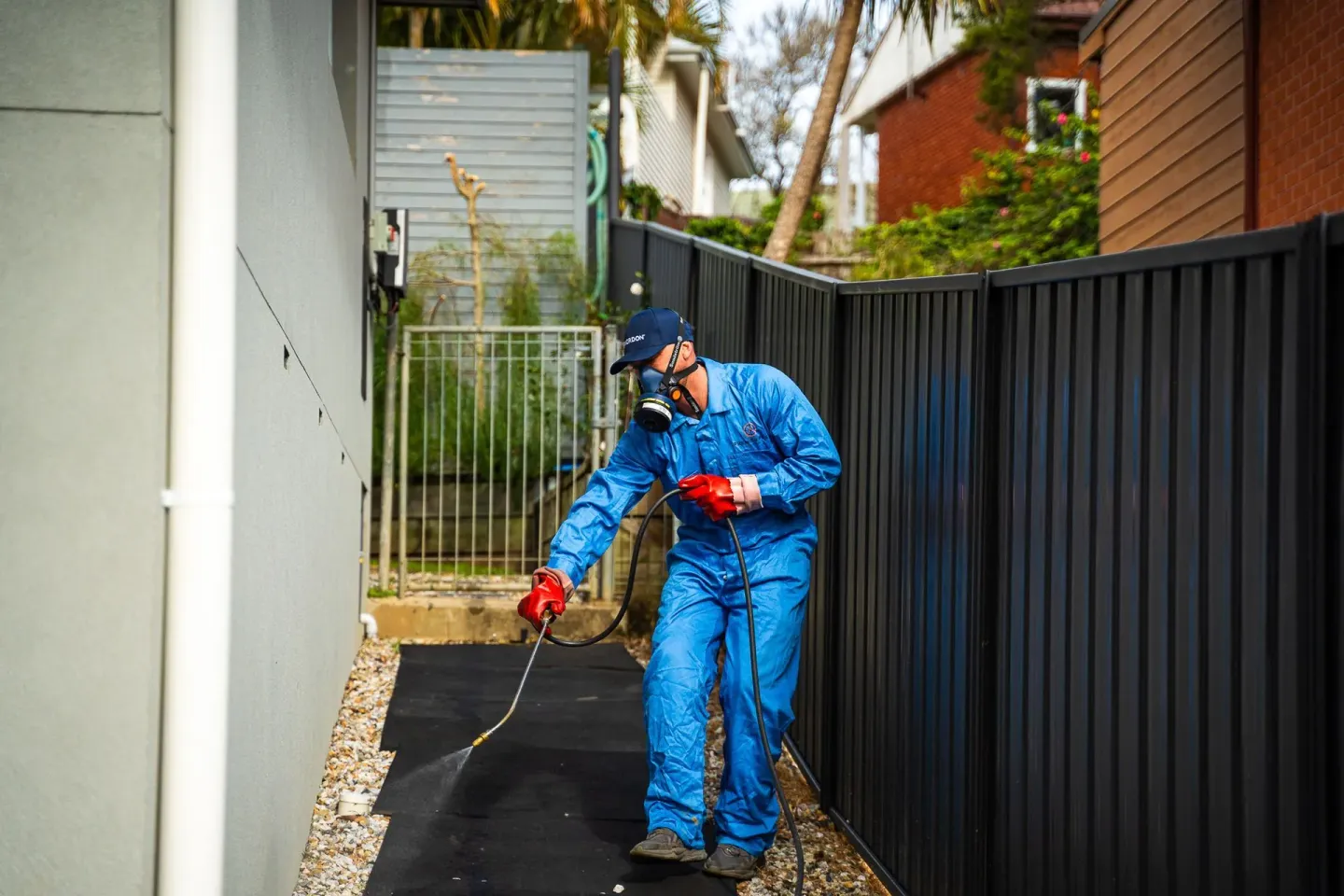 Premier Pest Control technician inspecting a property for rodents